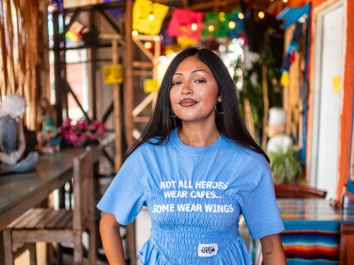 a woman at her family's mariscos restaurant
