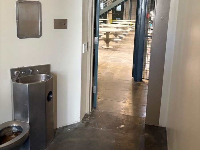 a cell with a toilet and sink
