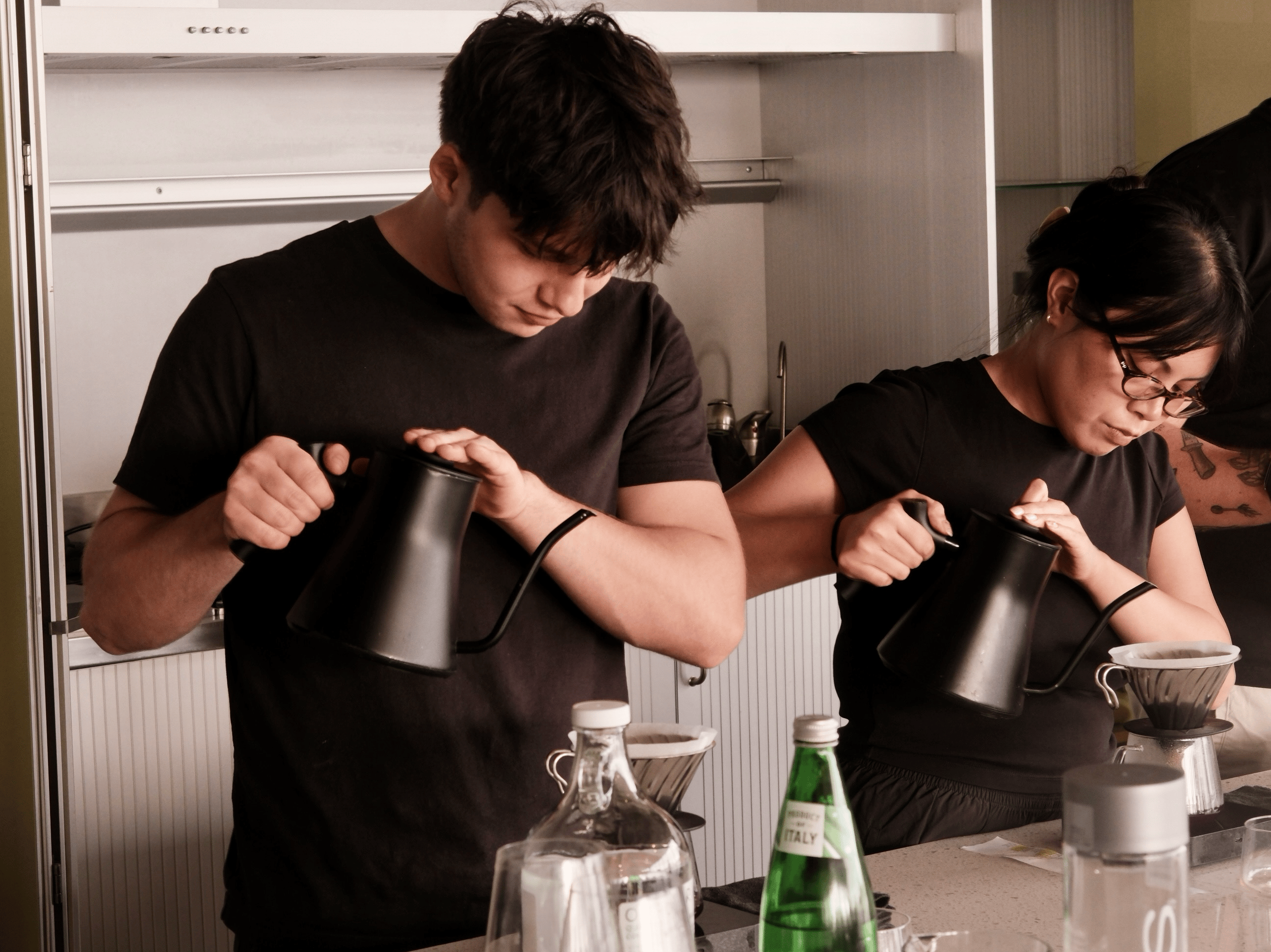 baristas preparing pourover coffee