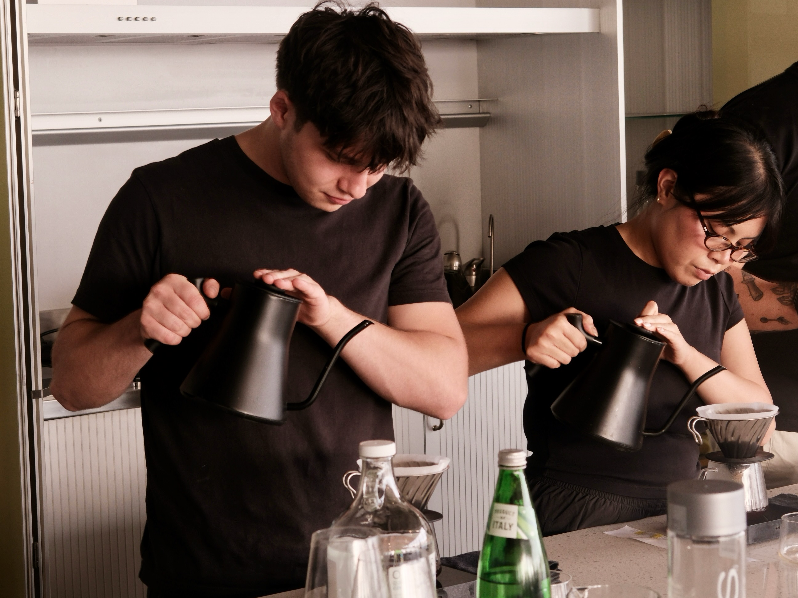 baristas preparing pourover coffee