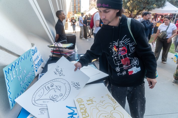 a person looking at art outside