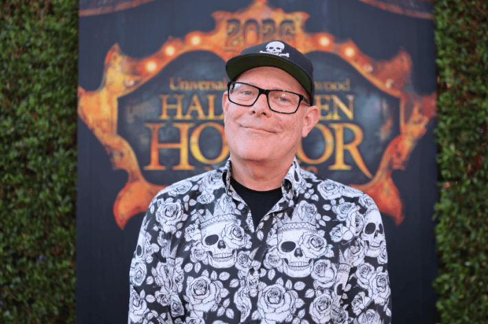 a man in a cap with a skull and crossbones smiling