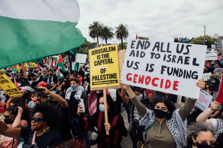 "End all aid to Israel US is funding genocide" a banner reads.