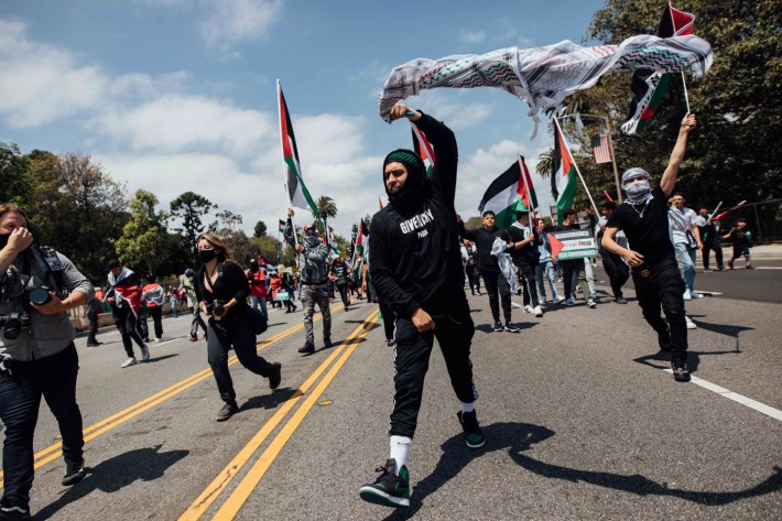 People march down Wilshire Blvd.