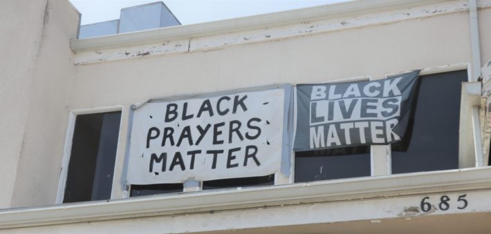 Banners hang on the front of the First Baptist Church of Venice on May 30, 2021