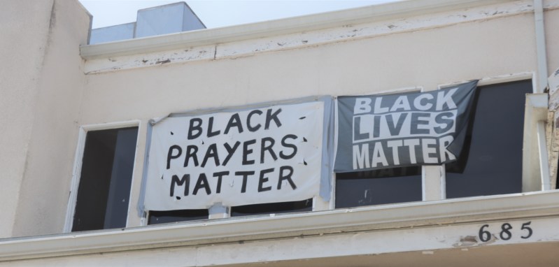 Banners hang on the front of the First Baptist Church of Venice on May 30, 2021