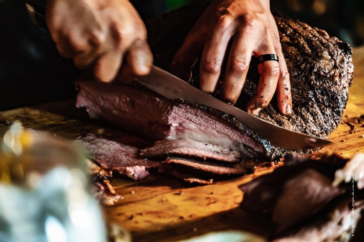 Slicing into Wagyu meat.