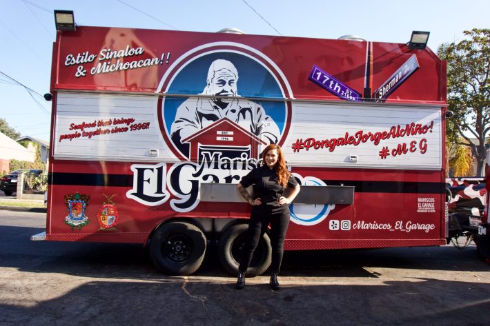 Elsa Barragan proudly stands in front of her first Mariscos el Garage food truck.