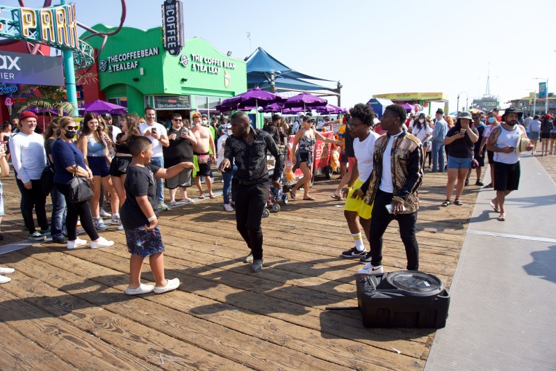 The dancing trio "High Off Energy" performs at Santa Monica Pier on a sunny Saturday afternoon. Photo by Janette Villafana for L.A. TACO.