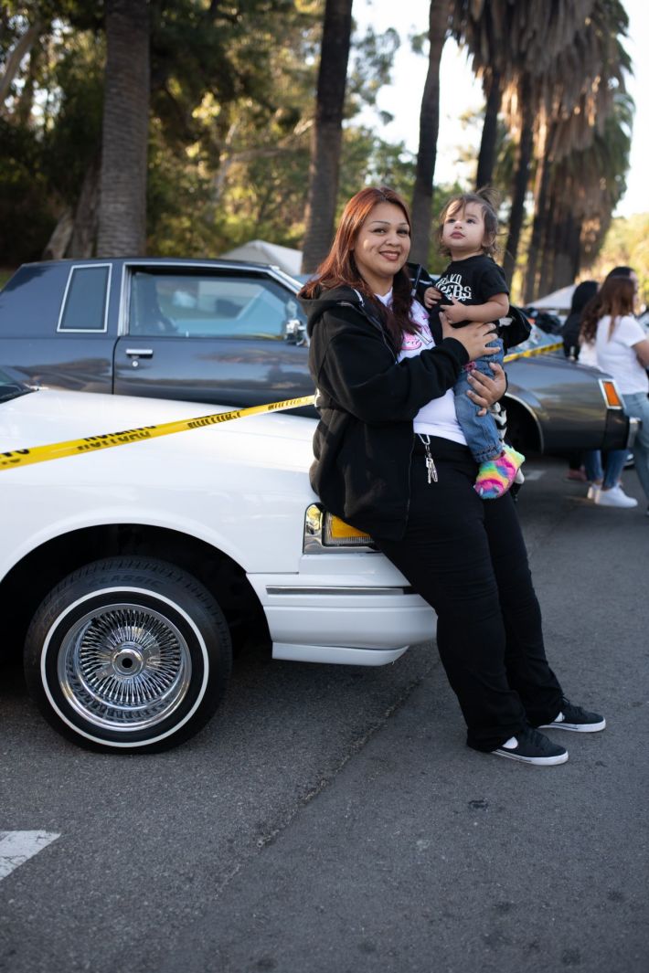 Women driving their lowrider.