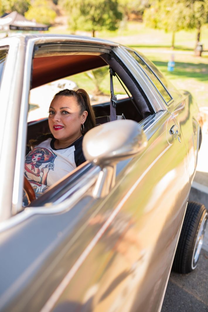 Women driving their lowrider.