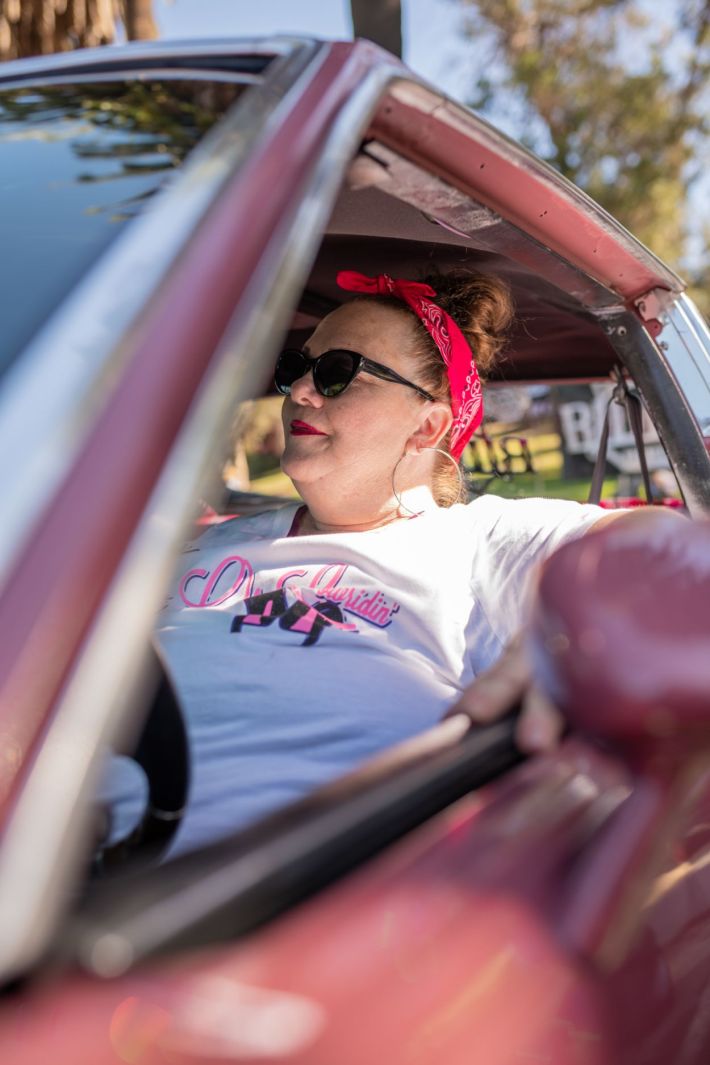 Women driving their lowrider.