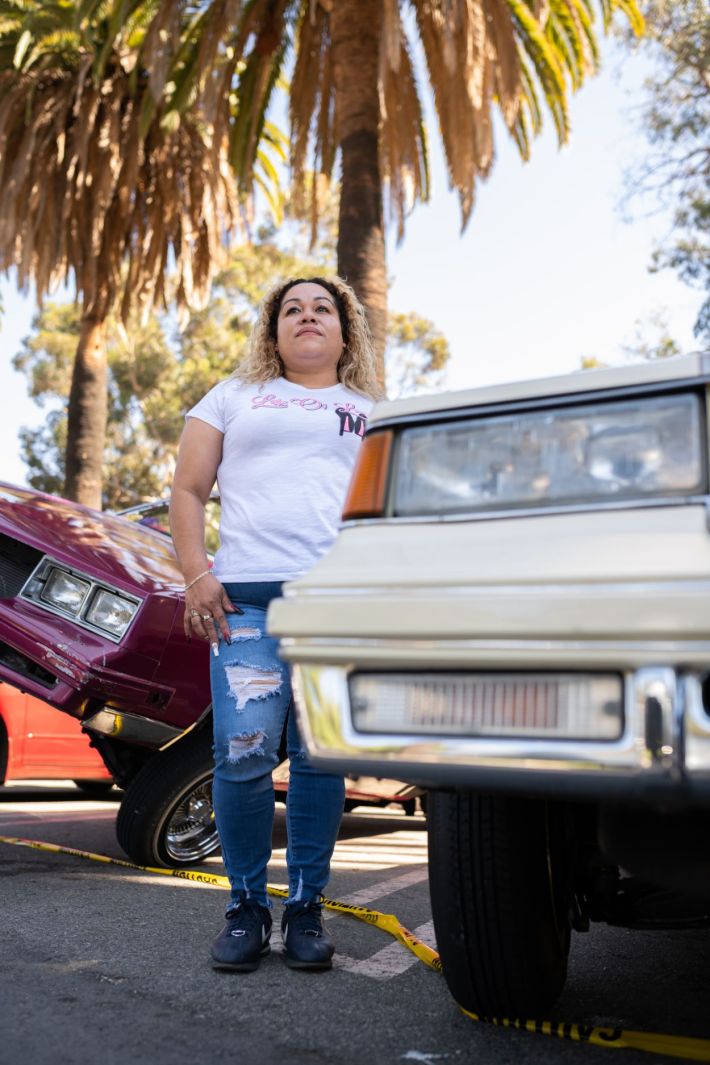 Women driving their lowrider.