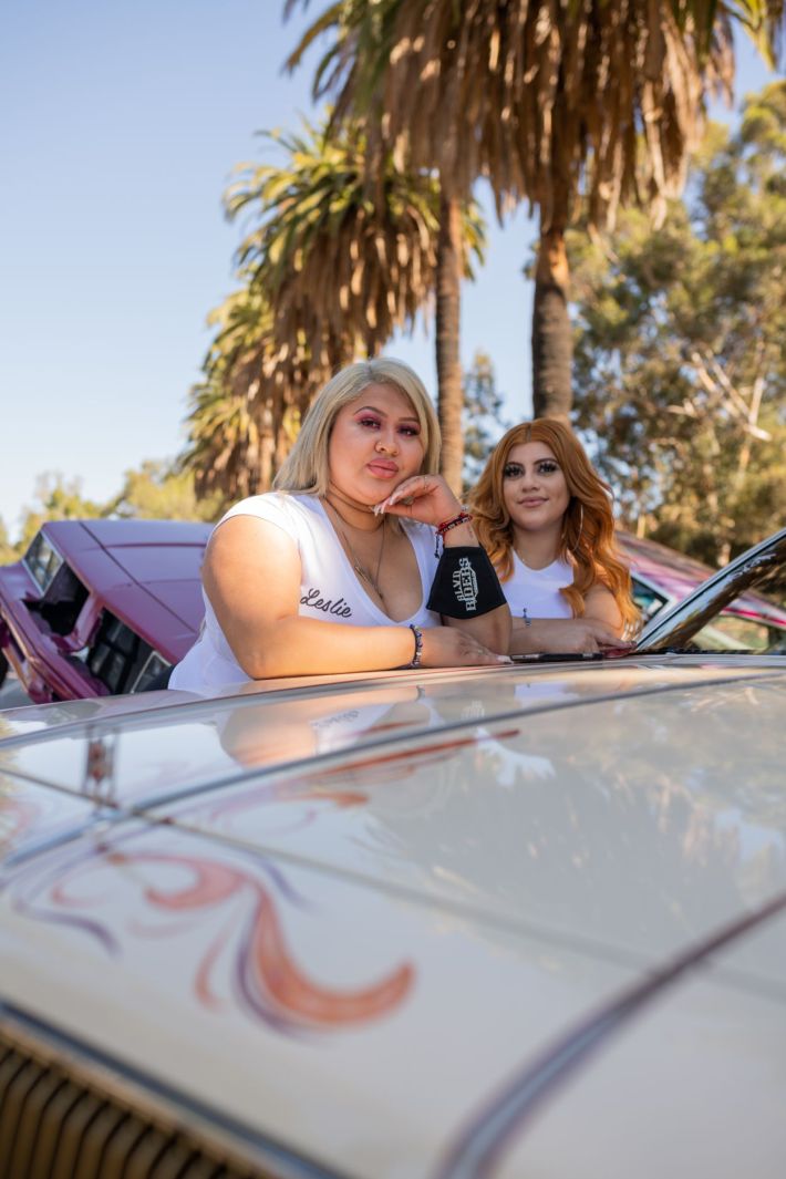 Women driving their lowrider.