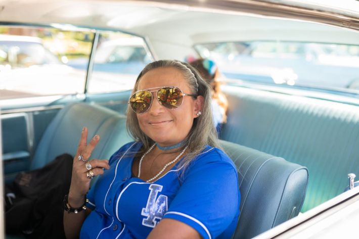 Women driving their lowrider.