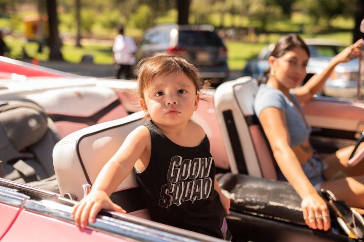 Women driving their lowriders.