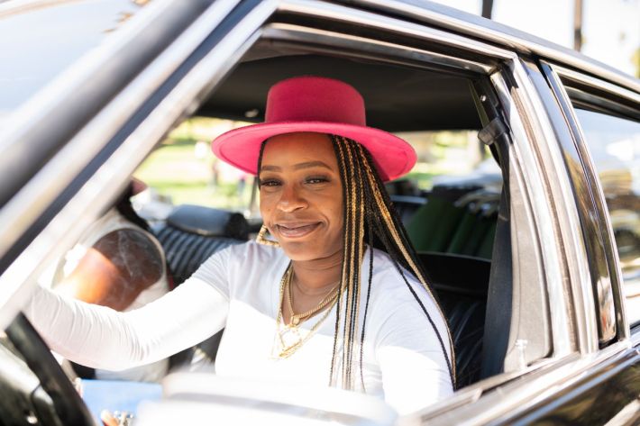 Women driving their lowriders.