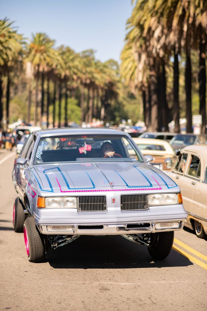 Women driving their lowrider.