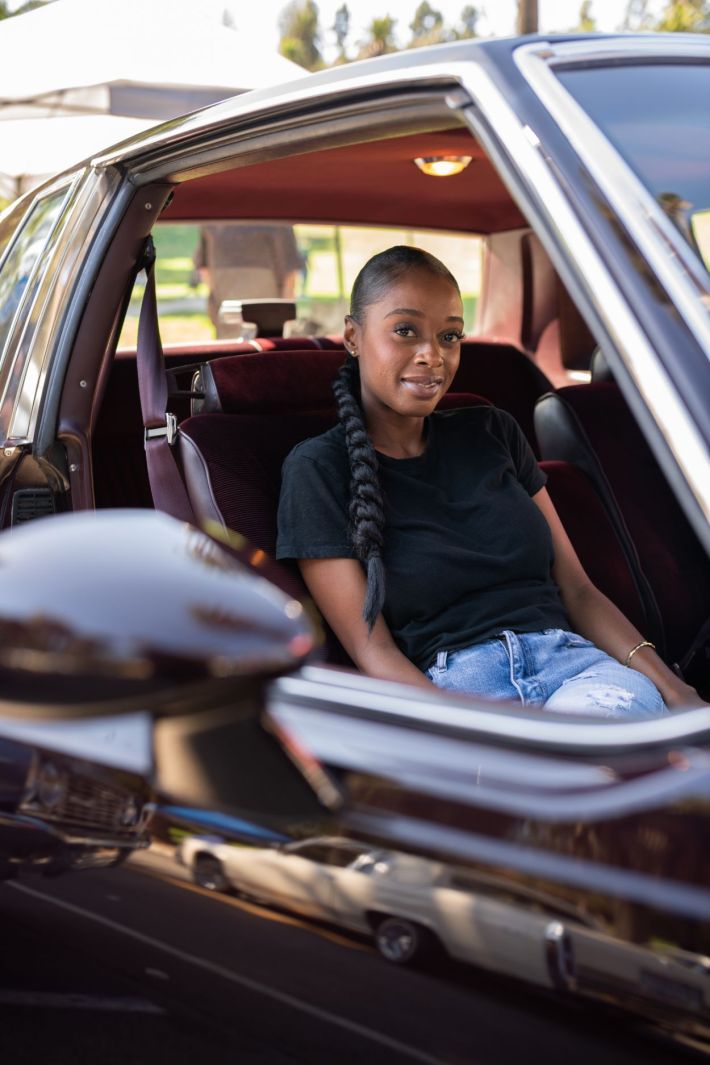 Women driving their lowrider.