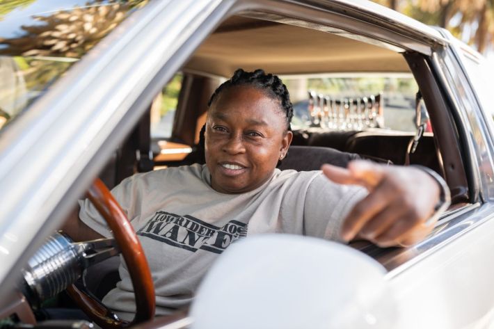 Women driving their lowriders.