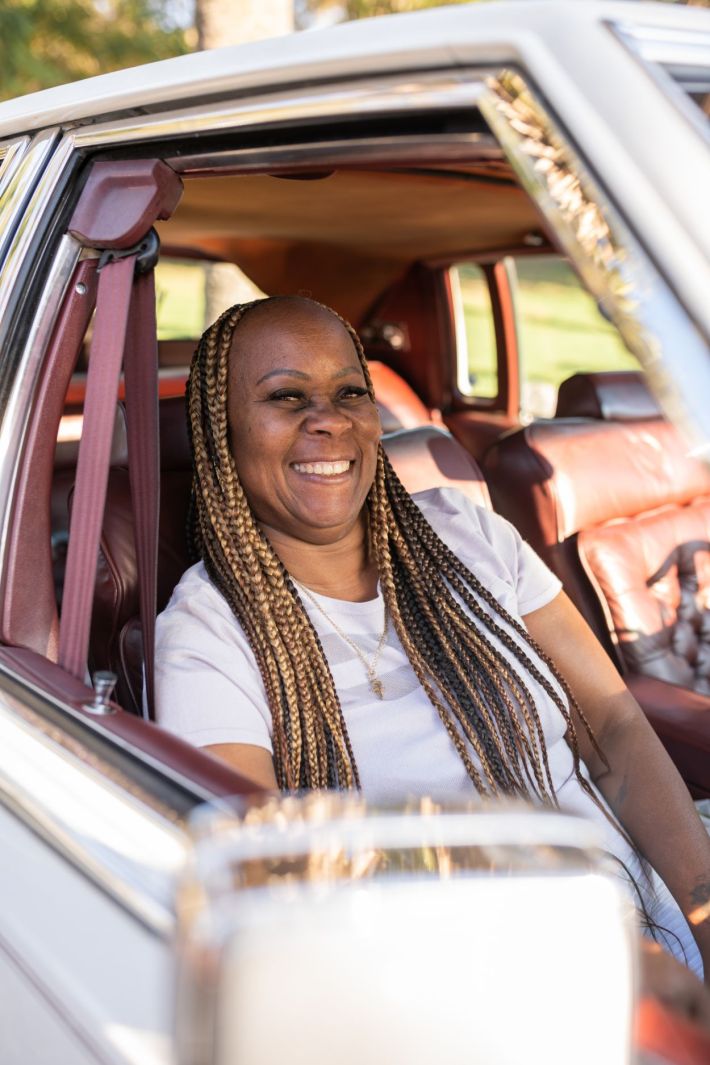 Women driving their lowriders.