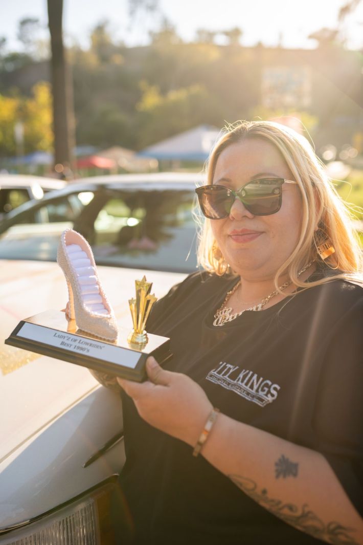 Women driving their lowriders.