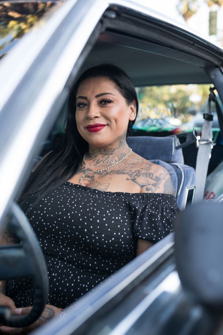 Women driving their lowriders.
