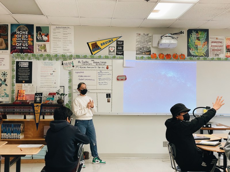 Ms. Dueñas, a 9th-grade ethnic studies teacher at Roosevelt's Math, Science & Technology Magnet Academy, prepares her class for their presentations.
