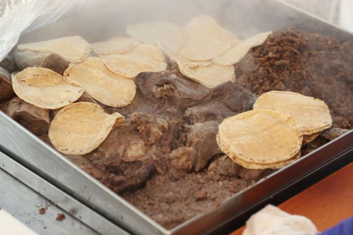 The tortillas absorb the juices from the steaming beef.