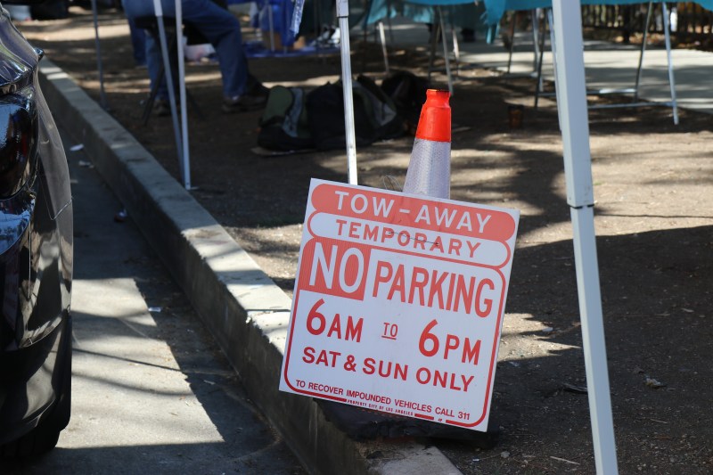 Parking signs went up recently. Vendors and nearby neighbors allege creates more problems for them.