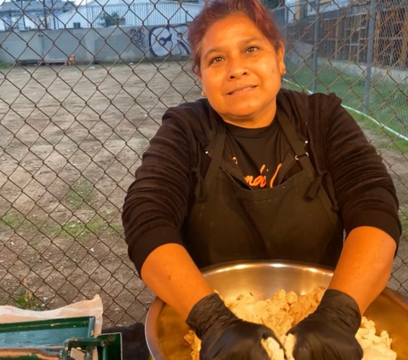 Margarita Vargas poses in front of Tacos San Juditas. Photo by Nancy Cruz.