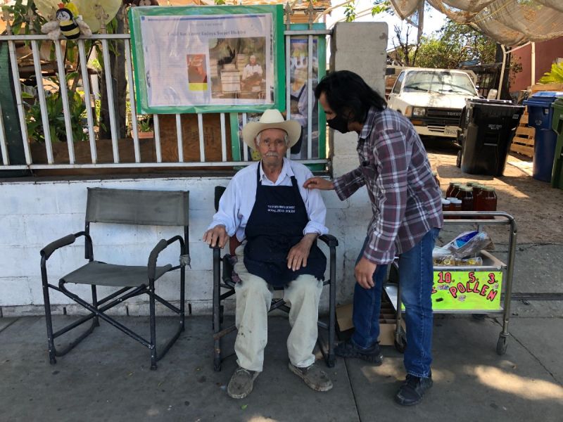 Victor Jaramillo selling bees outside his home in El Sereno.