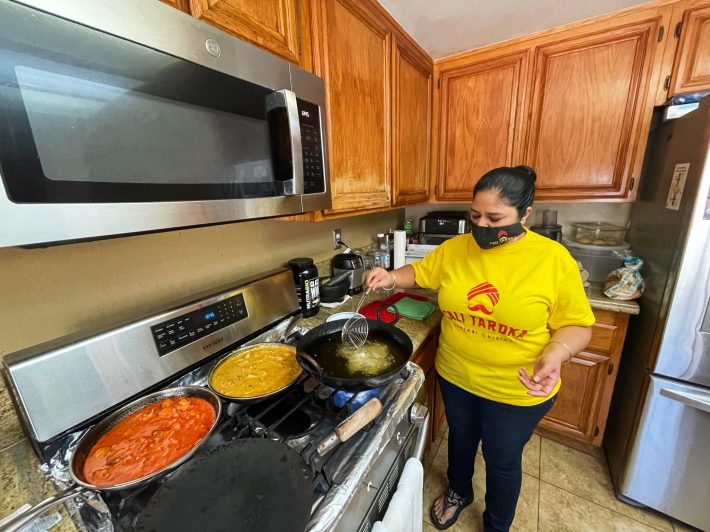 Kulwant “Kimi” Sanghu preparing food in her licensed home kitchen. Photo by Janette Villafana for L.A. TACO.