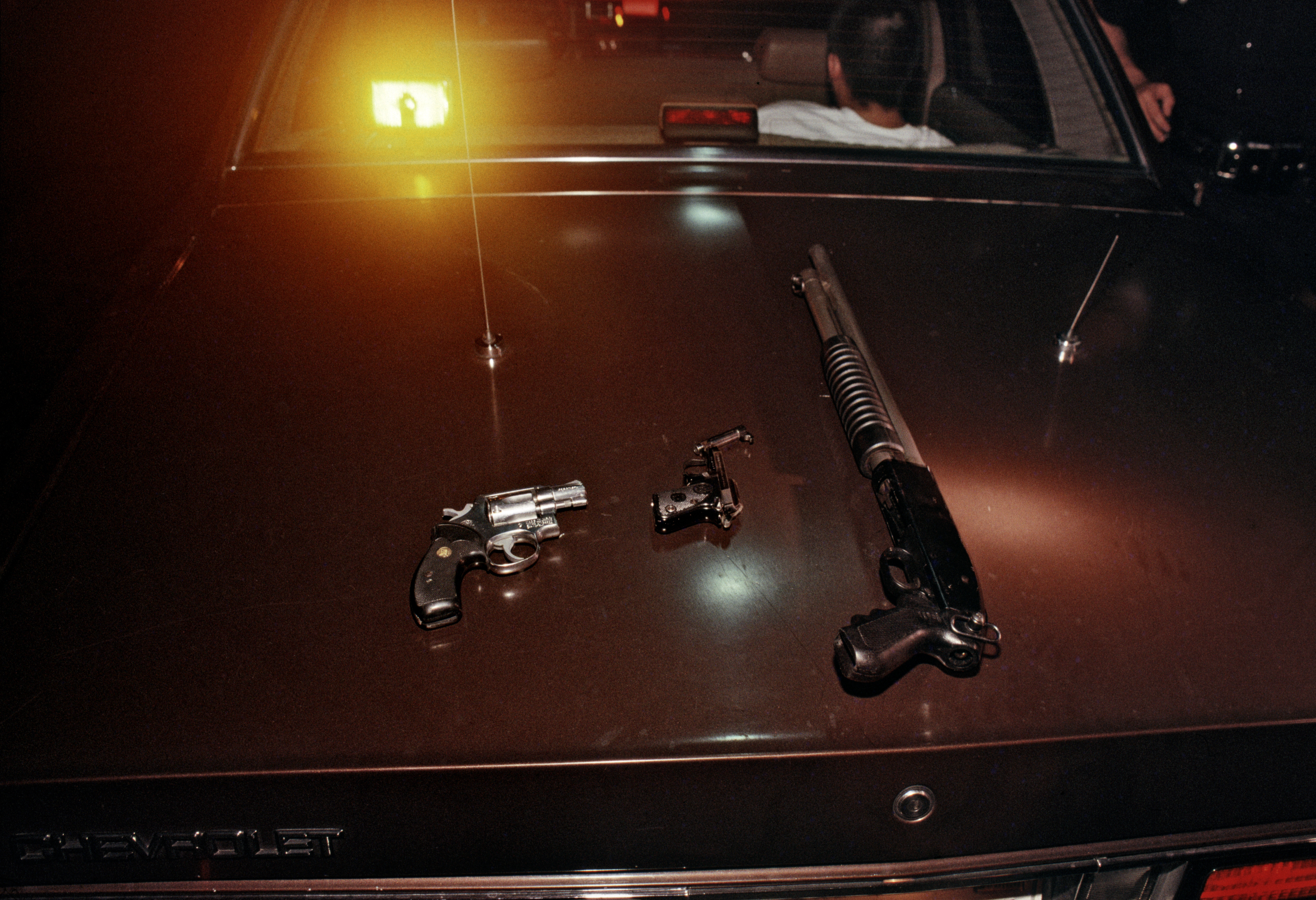CRASH unit from Rampart division confiscate guns after arresting some 18th Street gang members.
