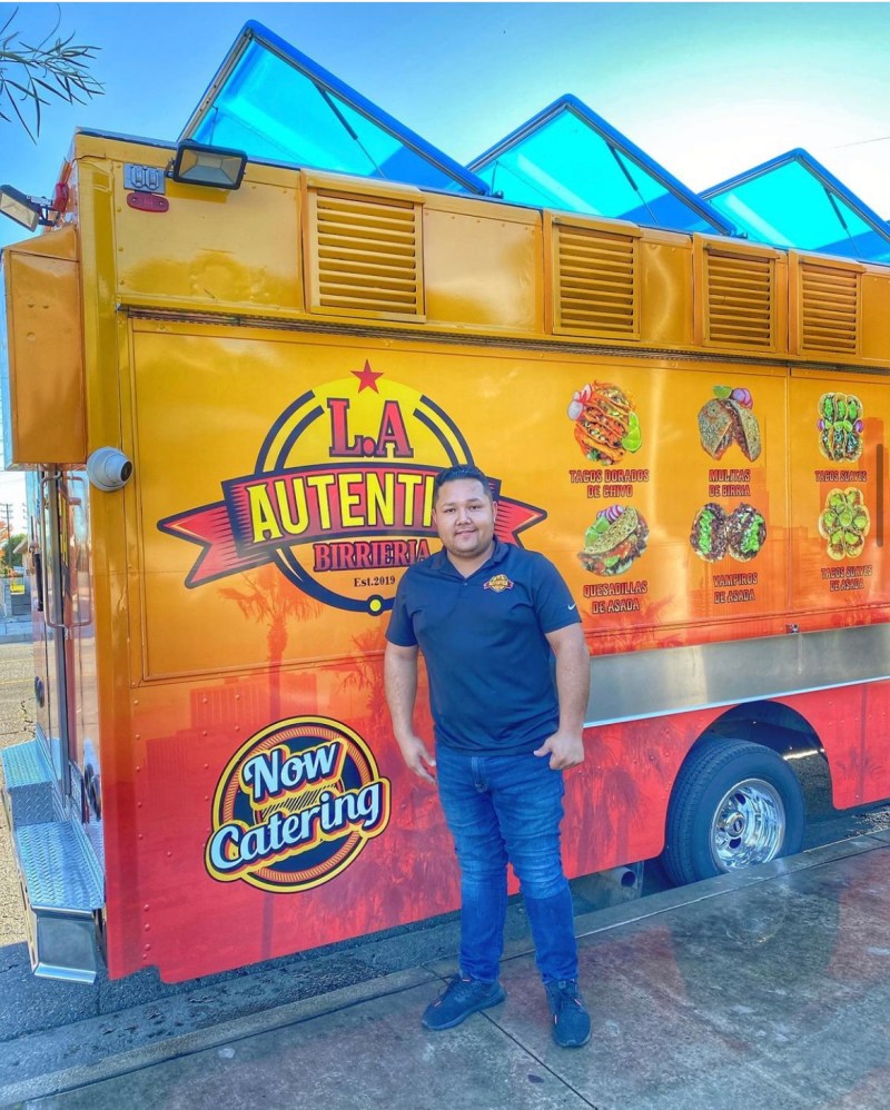 Jaime Arana Soria posing in front of his taco truck.