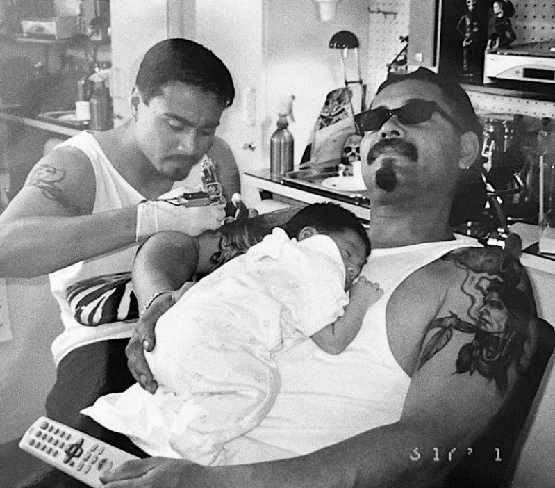 A young Jesse and his father, Jesse Sr, getting a placazo. 