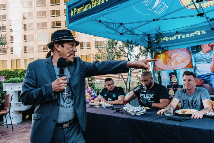 Danny Trejo hosting the taco eating competition.