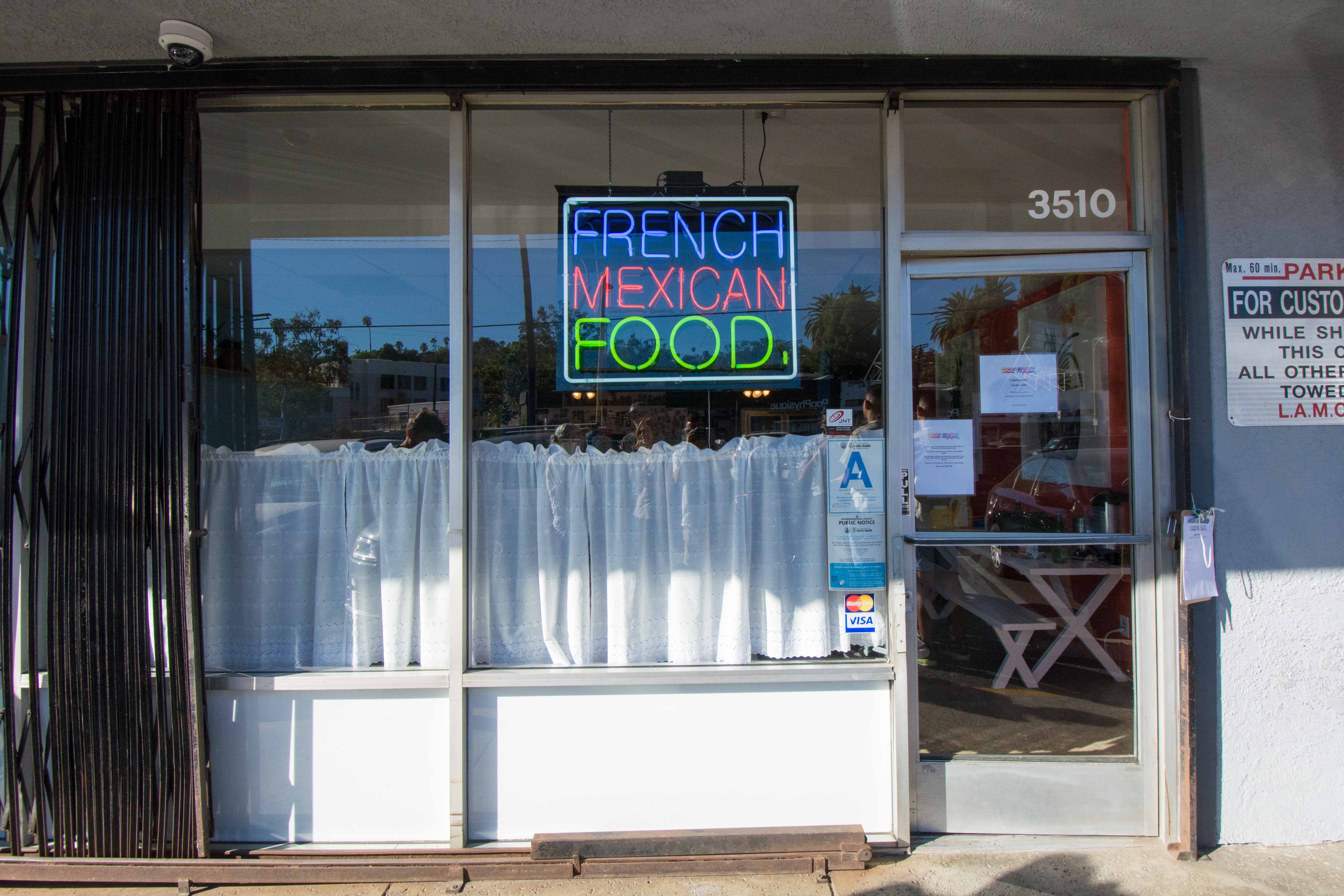 The "French Mexican Food" sign is by artist Patrick Martinez