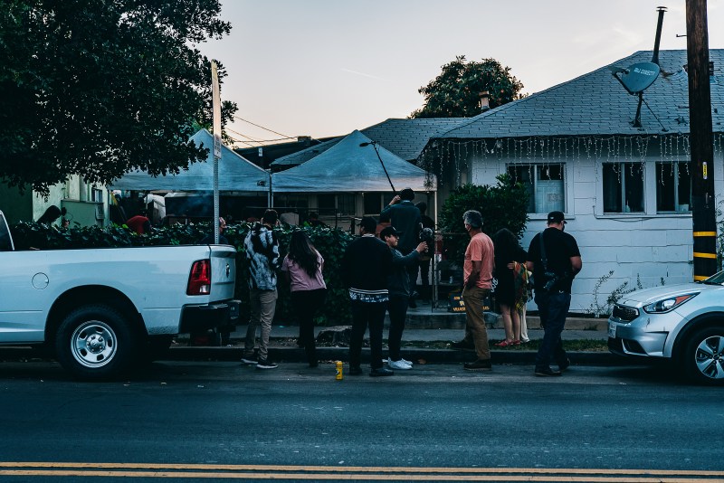 The sun sets in Highland Park as the crowd in front of Villa's Tacos builds.
