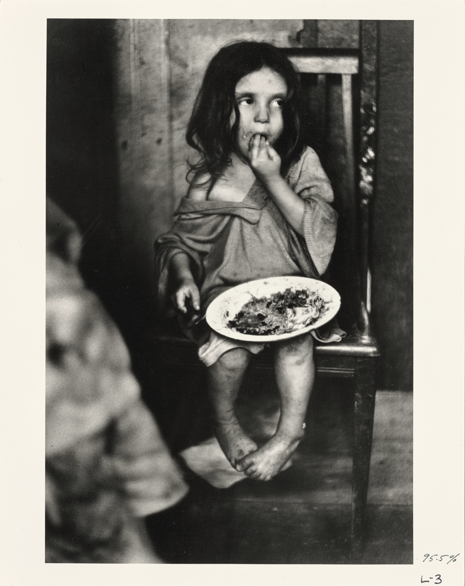 a girl with a plate of food