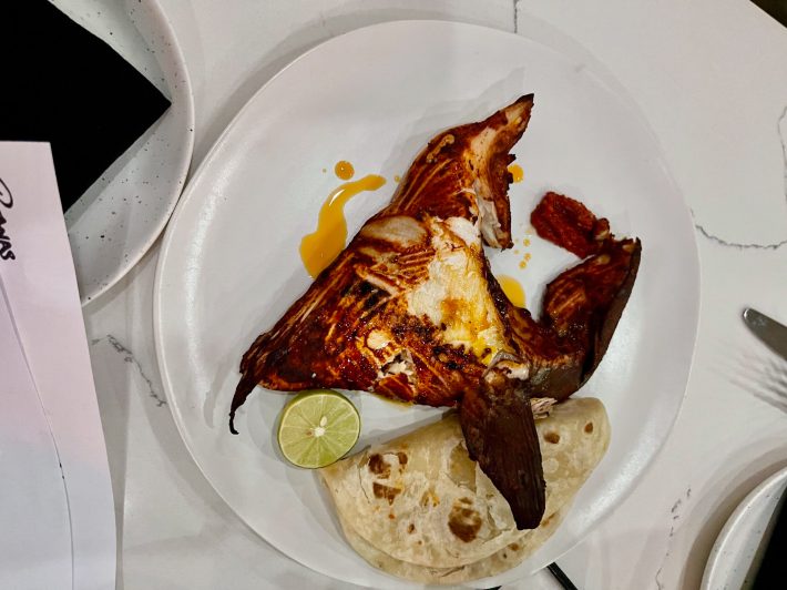 Grilled yellowtail with Mexikosho and pile of flour tortillas. Photo by Javier Cabral for L.A. TACO.