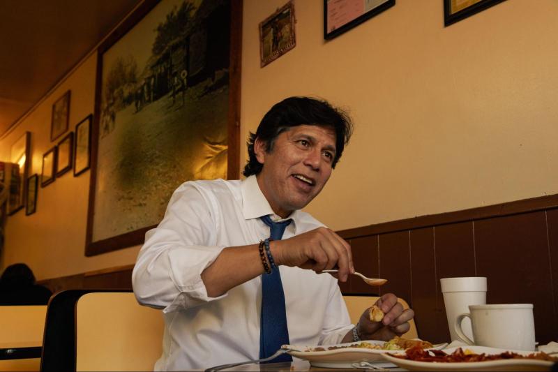 Kevin De León eating some enchiladas at Yeya's restaurant in Boyle Heights.