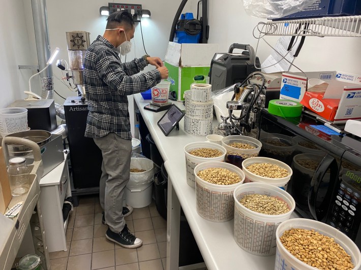 Ronald Dizon sorting through coffee.