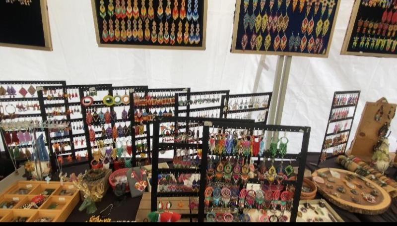 Aztec earrings and crystals display at Voces Indígenas stand. Photo by Nancy Cruz.