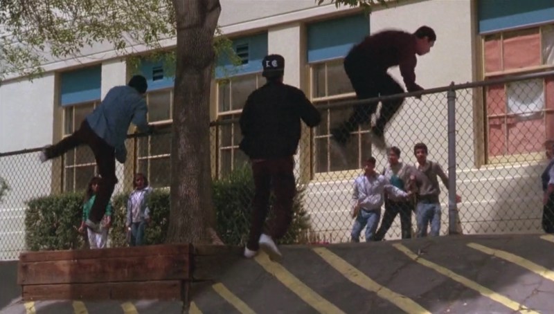 Gang chase through the school campus. Photo via Warner Bros. Pictures.