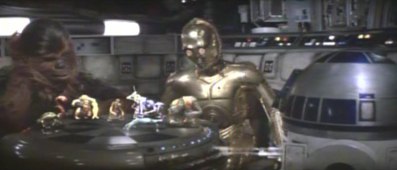 Chewbacca and R2-D2 play chess aboard the Millennium Falcon. Photo via Lucasfilm Ltd.