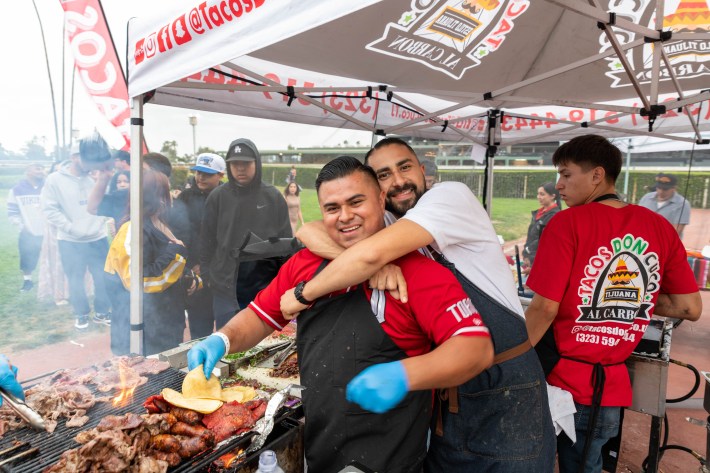 Jonathan from Tacos Don Cuco and Victor from Villa's Tacos hugging it out at TACO MADNESS.